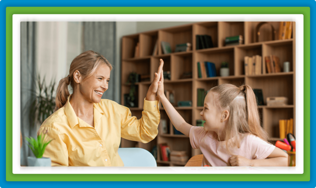 
A woman and a child give a high-five in a room with a bookshelf.