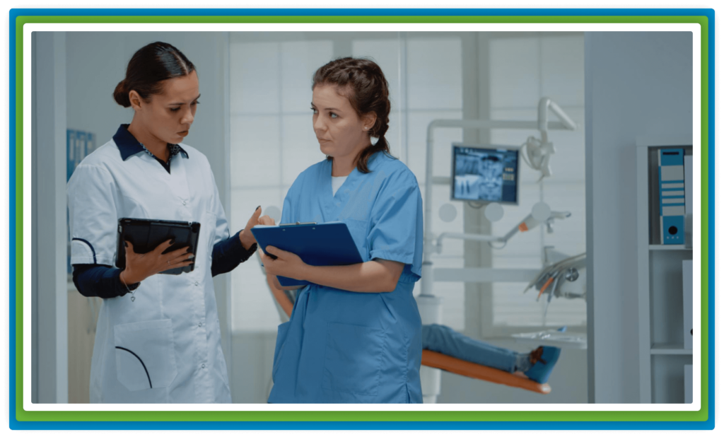 Two medical professionals discussing in an office.